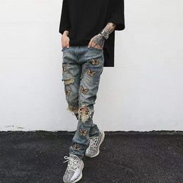 Men's jeans high street butterfly embroidery washed blue distressed ripped slim skinny jeans mens American hip-hop trousers