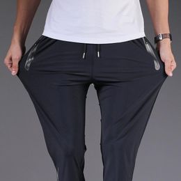 Calça de jeans masculino masculino de verão fino malha casual gelo ar-condicionado condicionamento rápido de tamanho grande de tamanho solto de menmmen