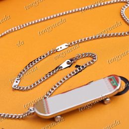 Luxury Fashion Designer Skateboard Pendant Necklaces Adjustable Chain Rotating Pulley Metal Engraved Letters for Men Women Gift