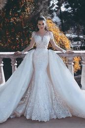 2020 Mermaid Wedding Dresses Jewel Neck Lace Appliques Beads Illusion Long Sleeves Open Back Overskirts Detachable Train Formal Bridal Gowns