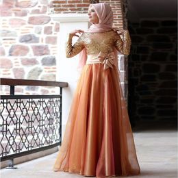 black and gold dress with hijab