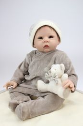 Realistic 22 Inch Cloth Body Doll Soft Silicone Vinyl Limbs Collection Reborn Baby Can Lying And Sitting Toy Wearing Headwear