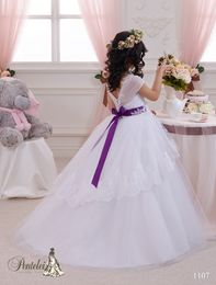 2016 Ball Gown Flower Girls Dresses with Shor Sleeves and Purple Sash Lace Appliqued Tulle Beautiful First Communion Gowns for Kids