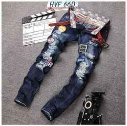 Wholesale-Personality Badge Patchwork Jeans Men Ripped Jeans Classic Rap Scratched Biker Jeans Hole Denim Straight Slim Fit Casual Pants