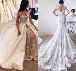 2017 New Luxury Overskirts Long Mermaid Wedding Dresses Jewel Neck Illusion Cap Sleeves Lace Appliques Crystal Beading Pearls Bridal Dress