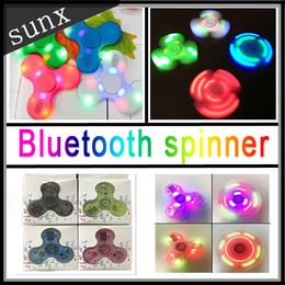 tri box UK - Rainbow Led Bluetooth Music Fidget Spinner F100 E104 light Finger Spinner Tri hand Spinner EDC Toy For Decompression with retail box
