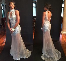 Sexy Nude Mermaid Prom Dresses 2018 High Neck Crystal Beaded Tulle See Through Backless Evening Gowns Sparkle Bling Party Dress