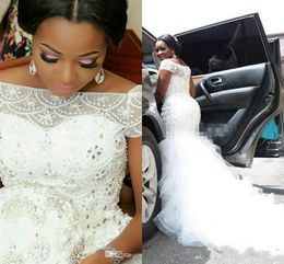 2020 Arabic Nigerian Mermaid Wedding Dresses Off Shoulder Beading Tiered Rullffes Short Sleeves Chapel Train Tulle Plus Size Bridal Gowns