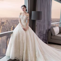 royal ball gown wedding dresses Canada - Off the Shoulder Crystals Beading Top Applique Lace Ball Gowns Wedding Dress with Royal Train Short Sleeves Bridal Dresses