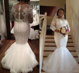 2017 New Cheap African Mermaid Wedding Dresses 3/4 Long Sleeves Jewel Neck Lace Appliques Beaded Floor Length Sheer Back Custom Bridal Gowns