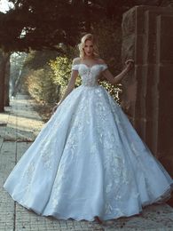 2018 New Ball Gown Wedding Dresses Off Shoulder Cap Sleeves Beads Lace 3D Floral Applique Backless Long Illusion Said Plus Size Bridal Gowns