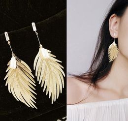 Hot Style Metallic feather stud pearl web celebrity temperament simple long style pendant personality earrings stylish classic exquisite