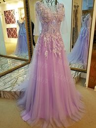 Abiti da ballo viola chiaro fata maniche lunghe sweep treno pieghe applique in tulle con perline abiti da passerella con lacci sul retro sexy illusione trasparente