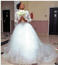 2024 African Plus Size A Line Wedding Dresses Vintage Lace Applique Beaded Illusion Long Sleeves Tulle Puffy Sweep Train Formal Bridal Gowns 403