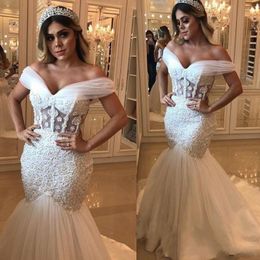 2019 New African Sexy Mermaid Wedding Dresses Off Shoulder Tulle Lace Applique Beads See Through Waist Sweep Train Plus Size Bridal Gowns