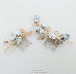 Bridal headwear with blue flowers, hair comb, pearls, U type hair pin, female head, wedding dress, and comb.