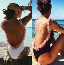 black swimsuit with pink flowers
