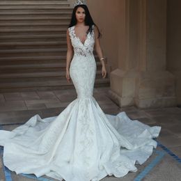 Deep V-Neck Mermaid Wedding Dresses Sleeveless Beads Lace Appliques Backless Bridal Dress Glamorous Dubai Lace Sweep Train Wedding Dresses