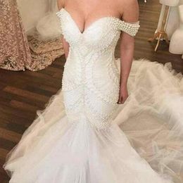 2019 Fabulous Mermaid Wedding Dresses Luxury Pearls Beading Fit and Flare Trumpet Bridal Gowns Tulle Skirt Off Shoulder robes de soirée