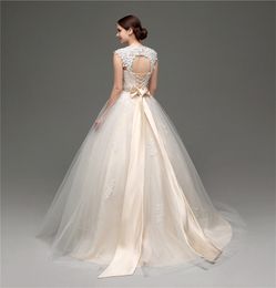 Stunning Champagne Wedding Dresses Ball Gown Eye Catching Pleats Tulle with Applique Lace Bridal Gowns Peplum