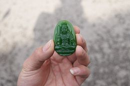 The beautiful outer Mongolian jade does not touch the bodhisattva (amulet). Hand-carved necklace pendant.