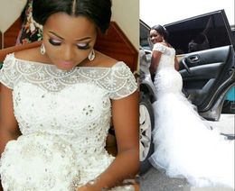 Plus Size Arabic Nigerian Mermaid Wedding Dresses Beaded Tiered Short Sleeves Chapel Train Tulle Luxury Crystal Ruffles Bridal Gowns