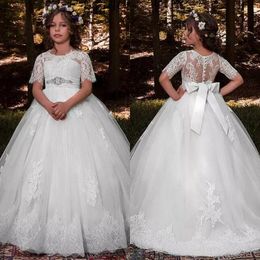 Princess First Communion Dresses Sheer Jewel Neck Short Sleeves Lace Appliques Puffy Tulle Flower Girl Gowns with Crystals and Bow