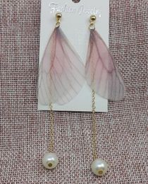 Hot Style Fashionable long feather beaded earrings women Japan and South Korea version of the simple temperament ear nail fashion classic de