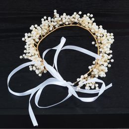 Bridal headwear, crown, hand-made pearl hair, bow tie, wedding dress and accessories.