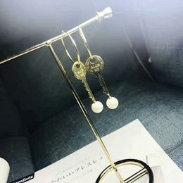 Fashion-New key pearl earrings S925 sterling silver simple fashion personality circle long earrings
