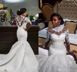 2019 Luxus Meerjungfrau Brautkleider Sheer Long Sleeve High Neck Kristall Perlen Kapelle Zug Afrikanische Arabische Brautkleider Plus Größe Angepasst