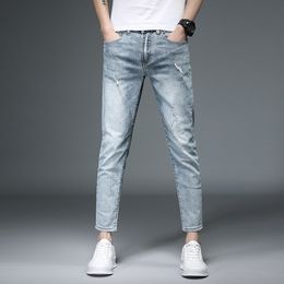 New men's skinny jeans light blue thin spring and summer men's jeans stretch Slim nine points jeans men's tide brand