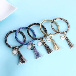 Encantos borla brazaletes clave PU de la hebilla del abrigo del cuero Pulseras Claves cadena de múltiples colores pulsera del anillo RRA2119 11style en venta