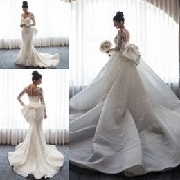 2020 Luxurious Mermaid Wedding Dresses Sheer Neck Illusion Lace Appliques Long Sleeves Button Back Bow With Detachable Train Bridal Gowns