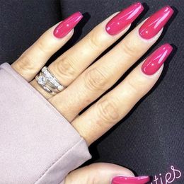 fake nails in the shape of a midlength coffin