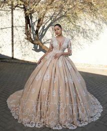 Gorgeous Champagne Ball Gown Wedding Dresses Deep V Neck Long Sleeve Appliques Bead Wedding Gown See Through Back Chapel Bridal Dress