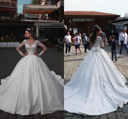 Luxurious Crystals Ball Gown Wedding Dresses 2020 Dubai Arabic Sheer Scoop Neck Long Sleeve Bridal Gown Long Satin Vestidos De Novia AL5699