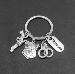 European and American Explosion-proof shield revolver bullet handcuffs Thank you buckle gun charm pendant keychain Jewelry Gift Making 467