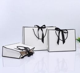 100pcs Creative design Black border White kraft paper bag with handle Wedding Party Favor bowknot Paper Gift Bag Custom logo