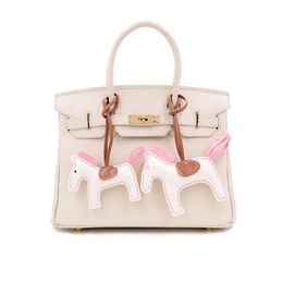 High End Handmade PU Bag Money Bag Pendant With Key Chains And Tassel Rodeo  Horse Charm In 17 Fashionable Colors DHL From Wenjingcomeon, $0.97