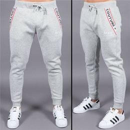 Pantaloni sportivi da uomo nuovi autunnali Pantaloni slim da uomo muscolosi Abiti da allenamento da corsa in cotone