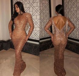 2020 Luxury Arabic Mermaid Long Prom Dresses Gold High Neck Långärmad Tassel Back Dubai Evening Party Gowns Vestidos BC0840