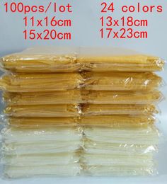 100pcs/lot 11x16 13x18 15x20 17x23cm Drawstring Organza Bags Silk Bags Wedding Party Christmas Candy Gift Bags Pouches Packaging T200602