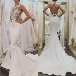 2020 Sexy Arabic Mermaid Wedding Dresses Jewel Neck Lace Appliques Beaded Satin See Though Sleeveless Open Back Sweep Train Bridal Gowns