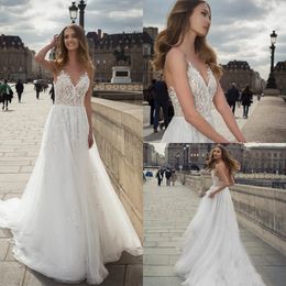 Bohemian Backless Wedding Dresses Sexy Spaghetti Neck Lace Appliqued Beads Flowing Flare Beach Bridal Wedding Gowns