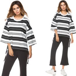 white and black striped pants outfit