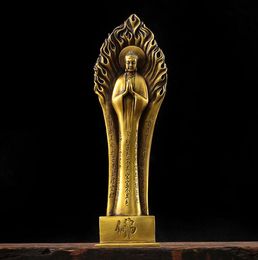 Bronze statue of Buddha Shakyamuni. Illuminated bronze statue of Buddha Shakyamuni. Bronze statue of Sari, standing on the Heart Sutra like