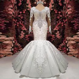 2020 New Gorgeous Crystal Lace Applique Mermaid Wedding Dresses Long Sleeve V-Neck Ruffle Puffy Bottom Bridal Gown Sheer Back