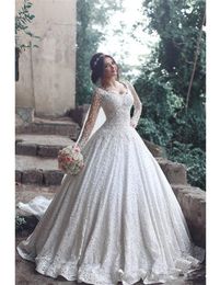 Arabic New Design Modern Wedding Dresses Scoop Neck Full Lace Crystal Beaded Long Sleeves Sweep Train Plus Size Formal Bridal Gowns