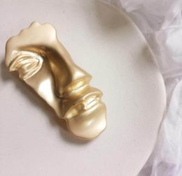 Fashion- new shelves unique versatile exaggerated head brooch Golden half face mask suit brooch accessories pin